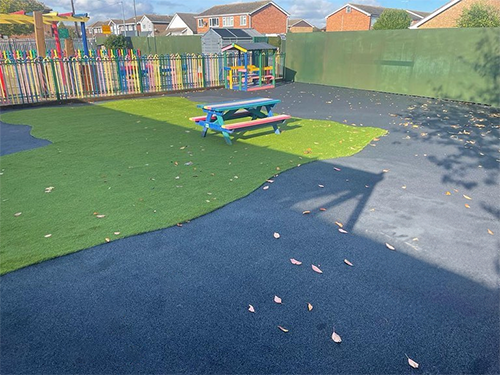 tarmac playground with artificial grass area